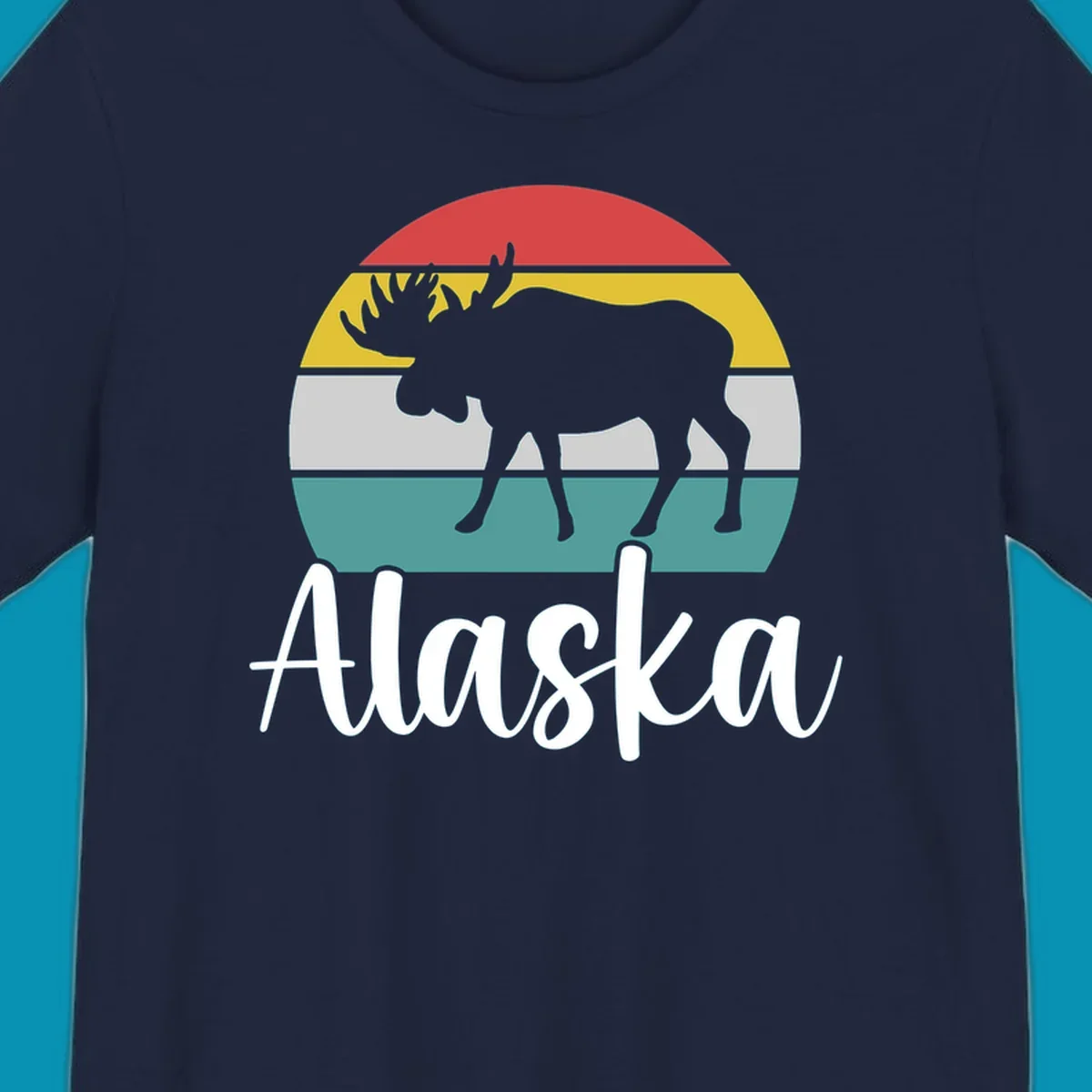 White moose silhouette against red, gold, gray, and teal horizontal stripes in a circular badge design representing Alaska mountains and wildlife.