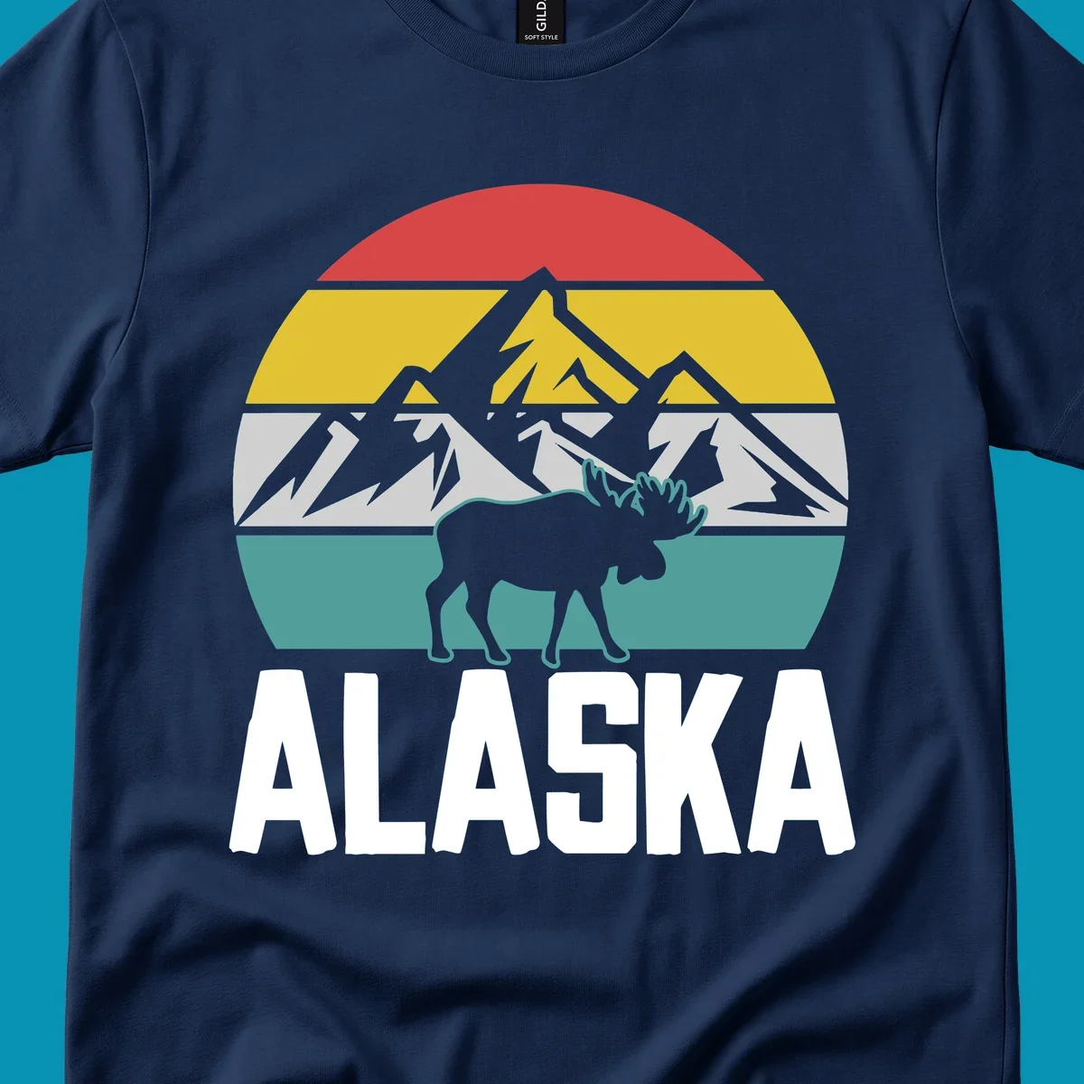 Moose mountain Alaska badge with white moose silhouette, snow peaks, and horizontal landscape stripes in red, gold, gray, and teal.