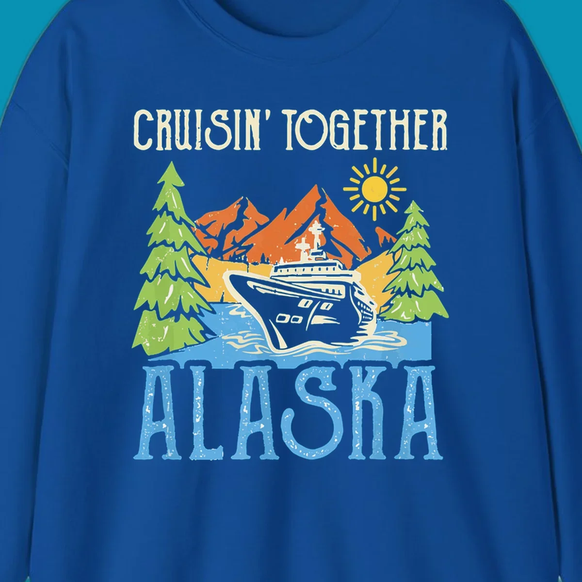Cruisin' Together Alaska design featuring a cruise ship in front of snow-capped mountains, evergreen trees, and bright sun with distressed lettering