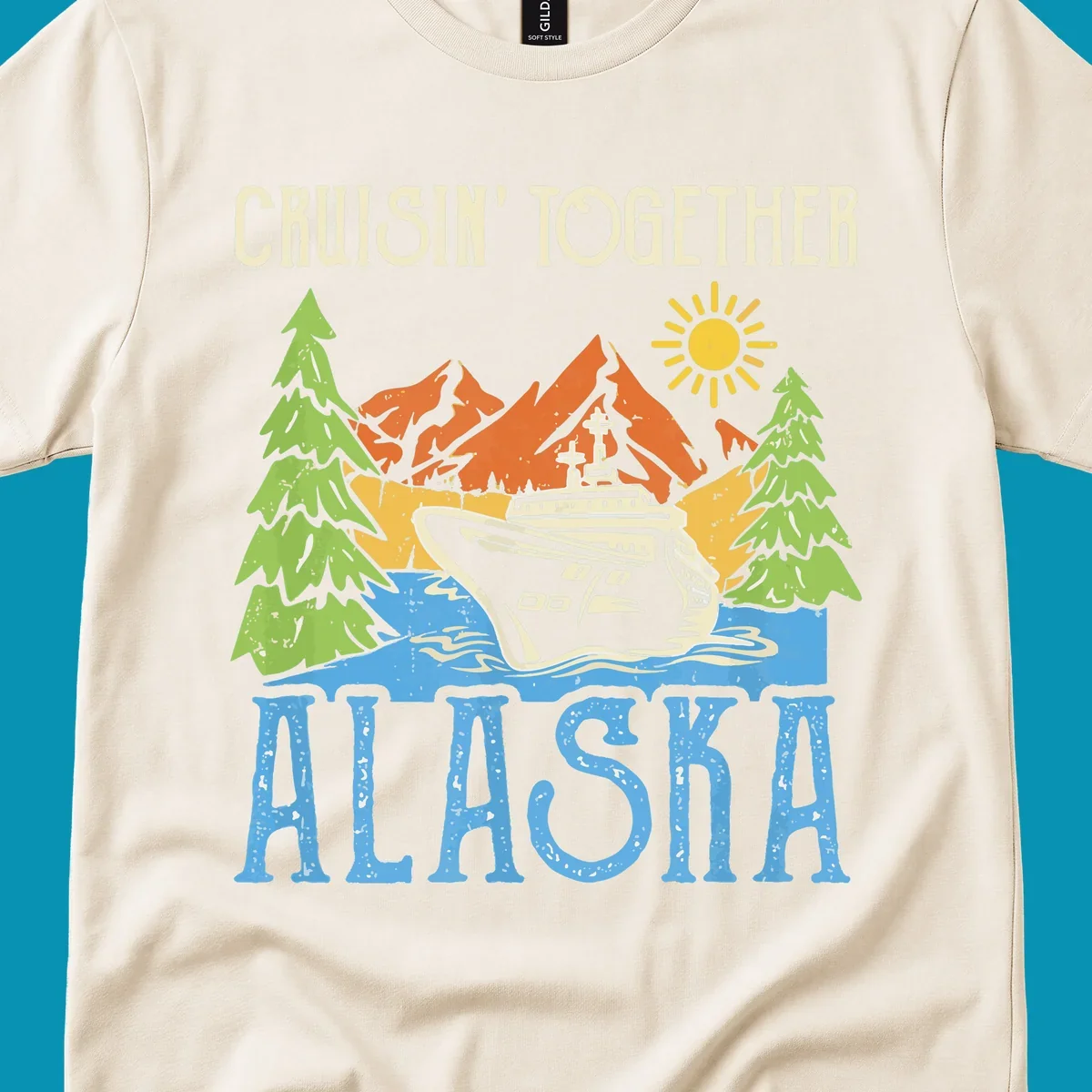 Cruisin' Together Alaska design featuring a cruise ship in front of snow-capped mountains, evergreen trees, and bright sun with distressed lettering