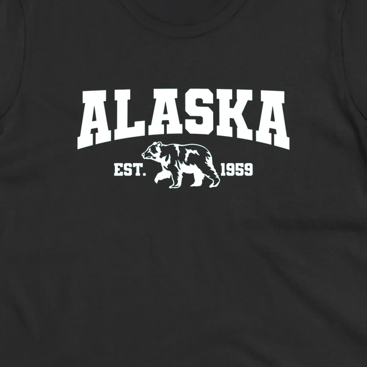 Vintage-style Alaska bear design with distressed lettering, established 1959, featuring pine trees and wildlife illustration