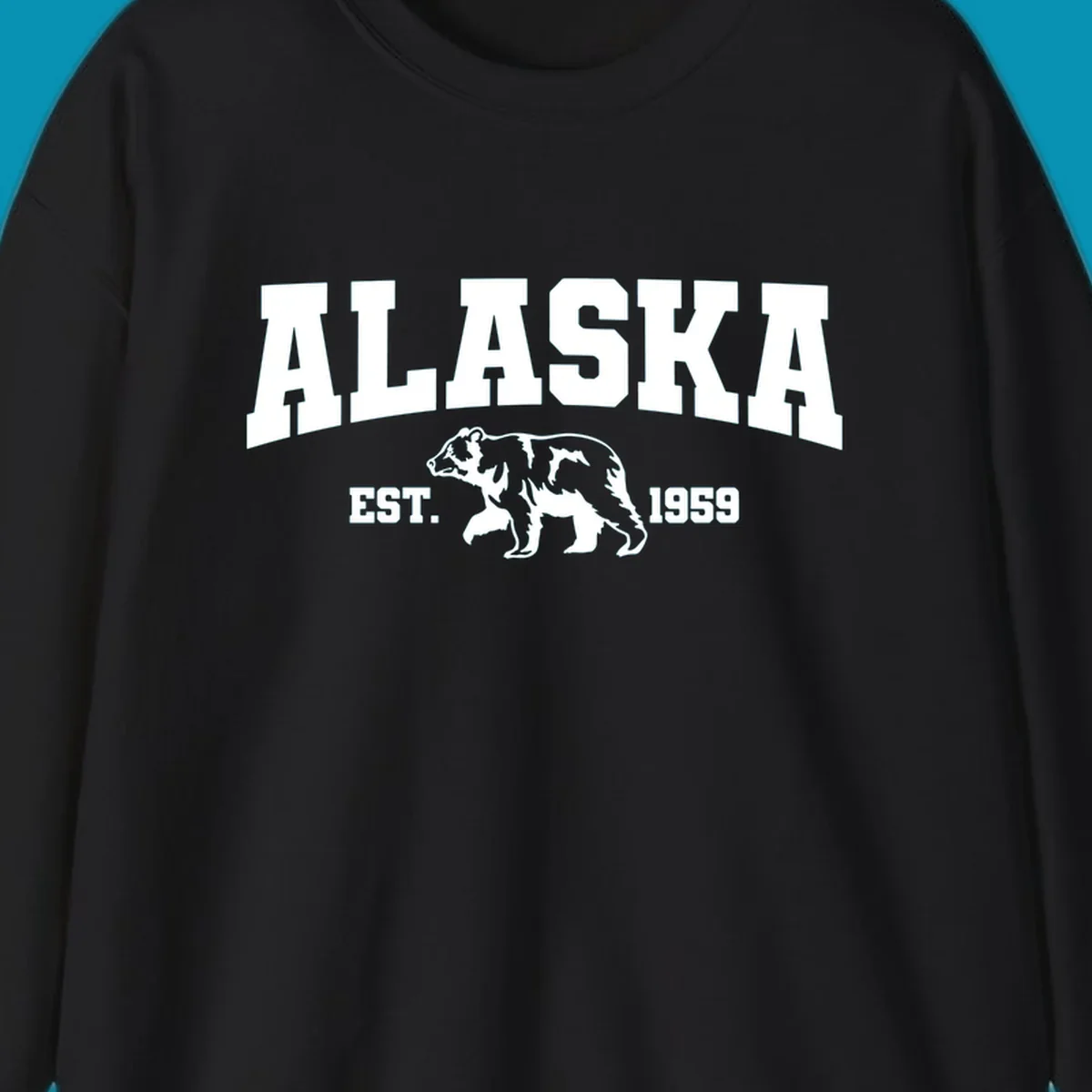 Vintage-style Alaska bear design with distressed lettering, established 1959, featuring pine trees and wildlife illustration