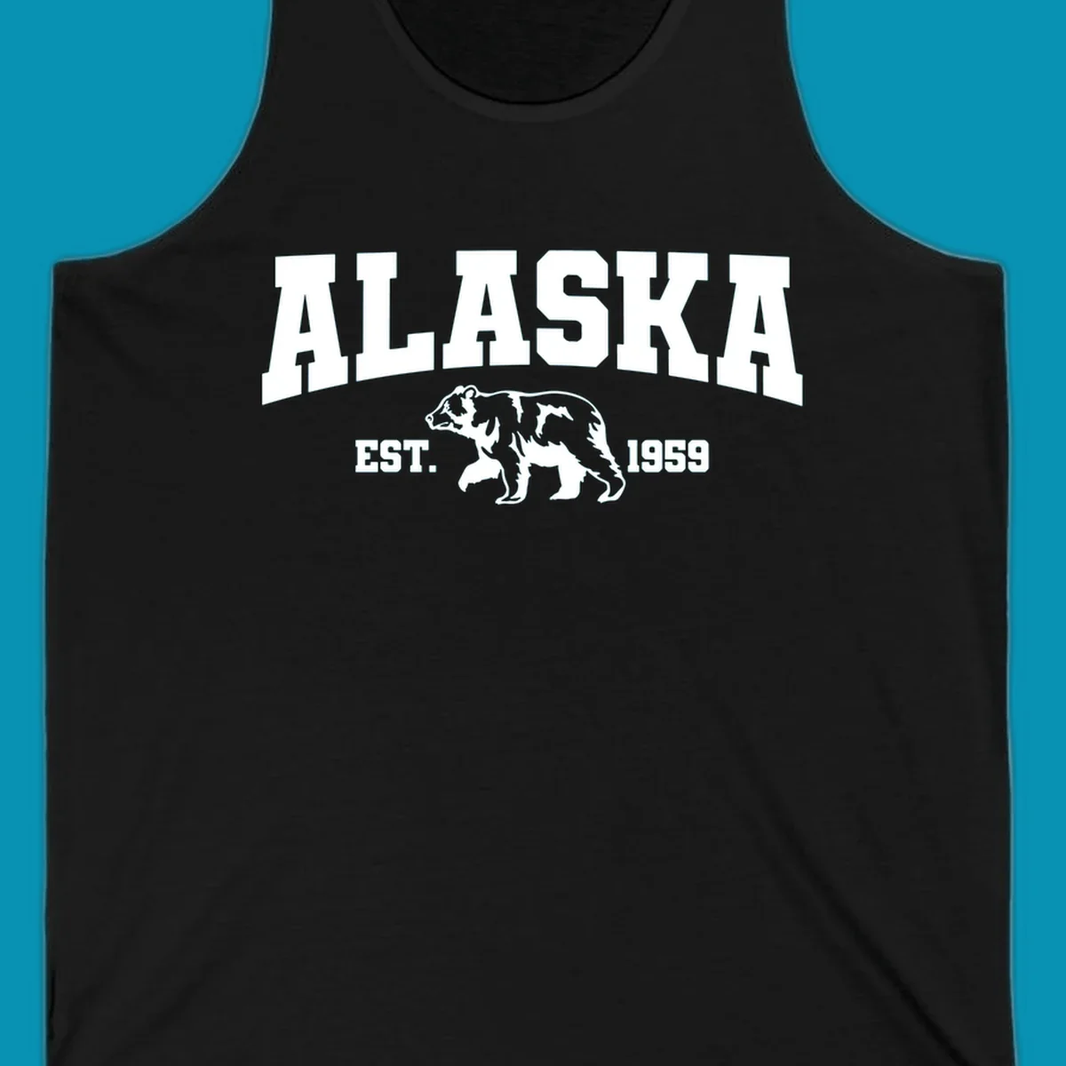 Vintage-style Alaska bear design with distressed lettering, established 1959, featuring pine trees and wildlife illustration
