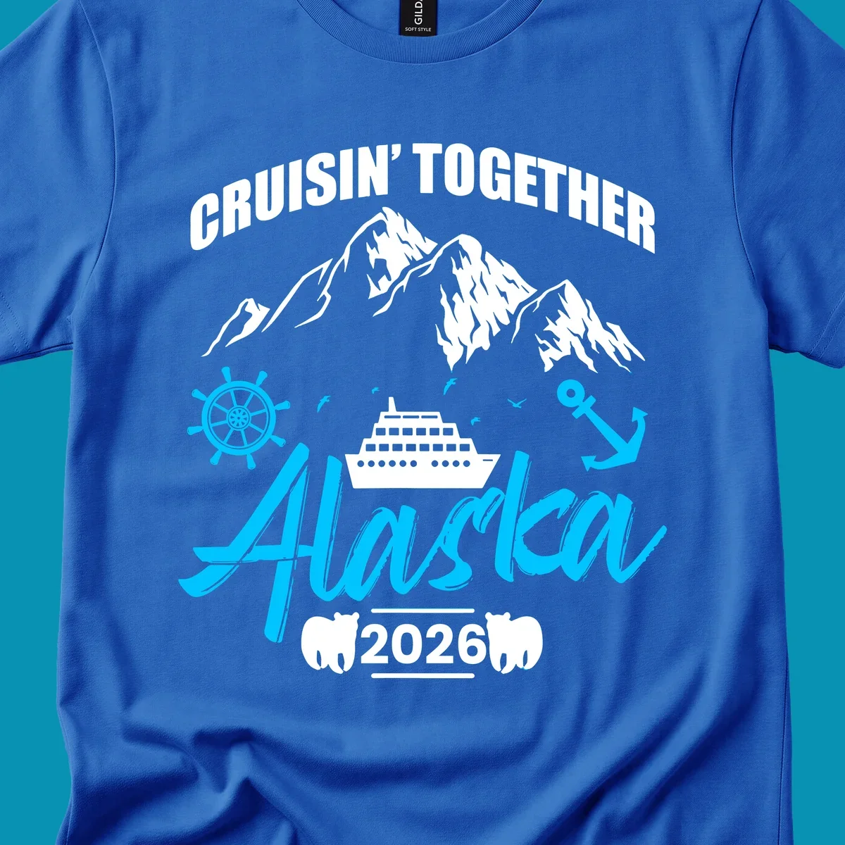 Bright cyan nautical design with 'All Aboard' script, ship's wheel, anchor, and seagulls for cruise apparel.