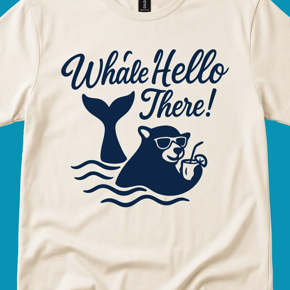 Smiling whale wearing sunglasses holding tropical drink with 'Whale Hello There!' text and ocean waves on gray background