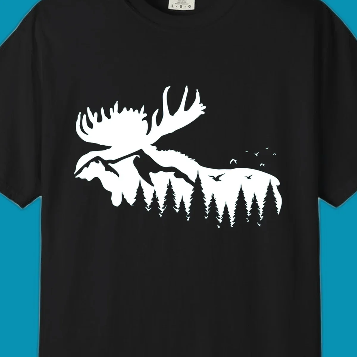 White silhouette of a moose with large antlers integrated into a forested mountain landscape with evergreen trees and flying birds against gray background.