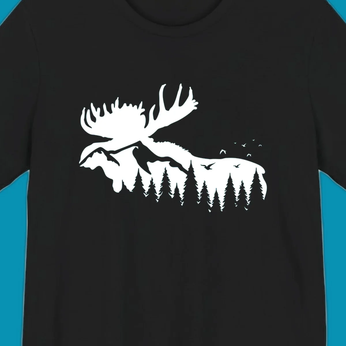 White silhouette of a moose with large antlers integrated into a forested mountain landscape with evergreen trees and flying birds against gray background.