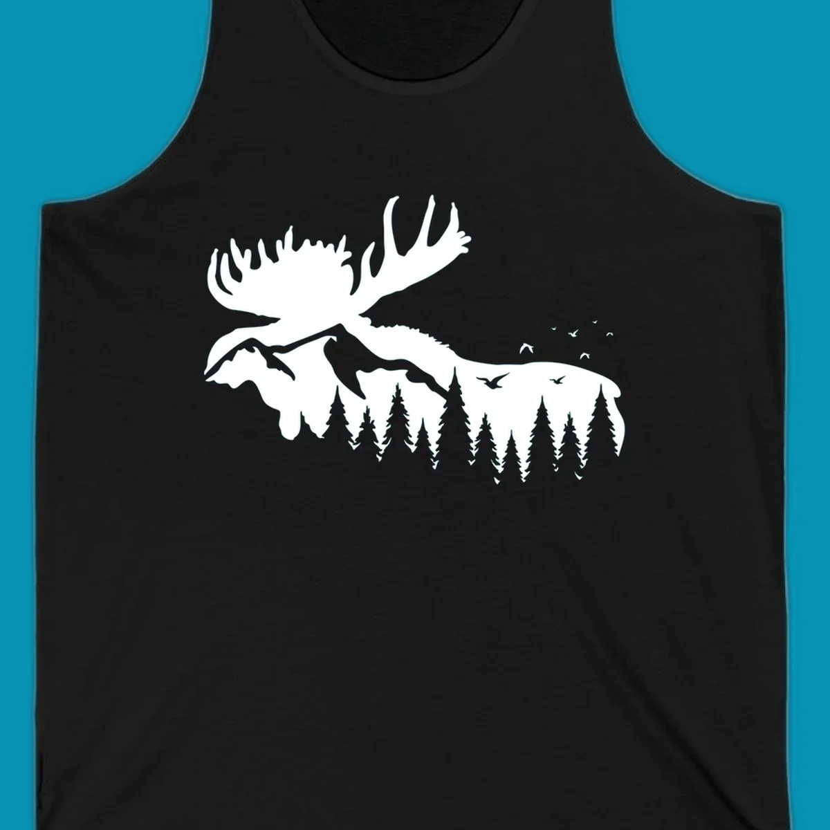 White silhouette of a moose with large antlers integrated into a forested mountain landscape with evergreen trees and flying birds against gray background.