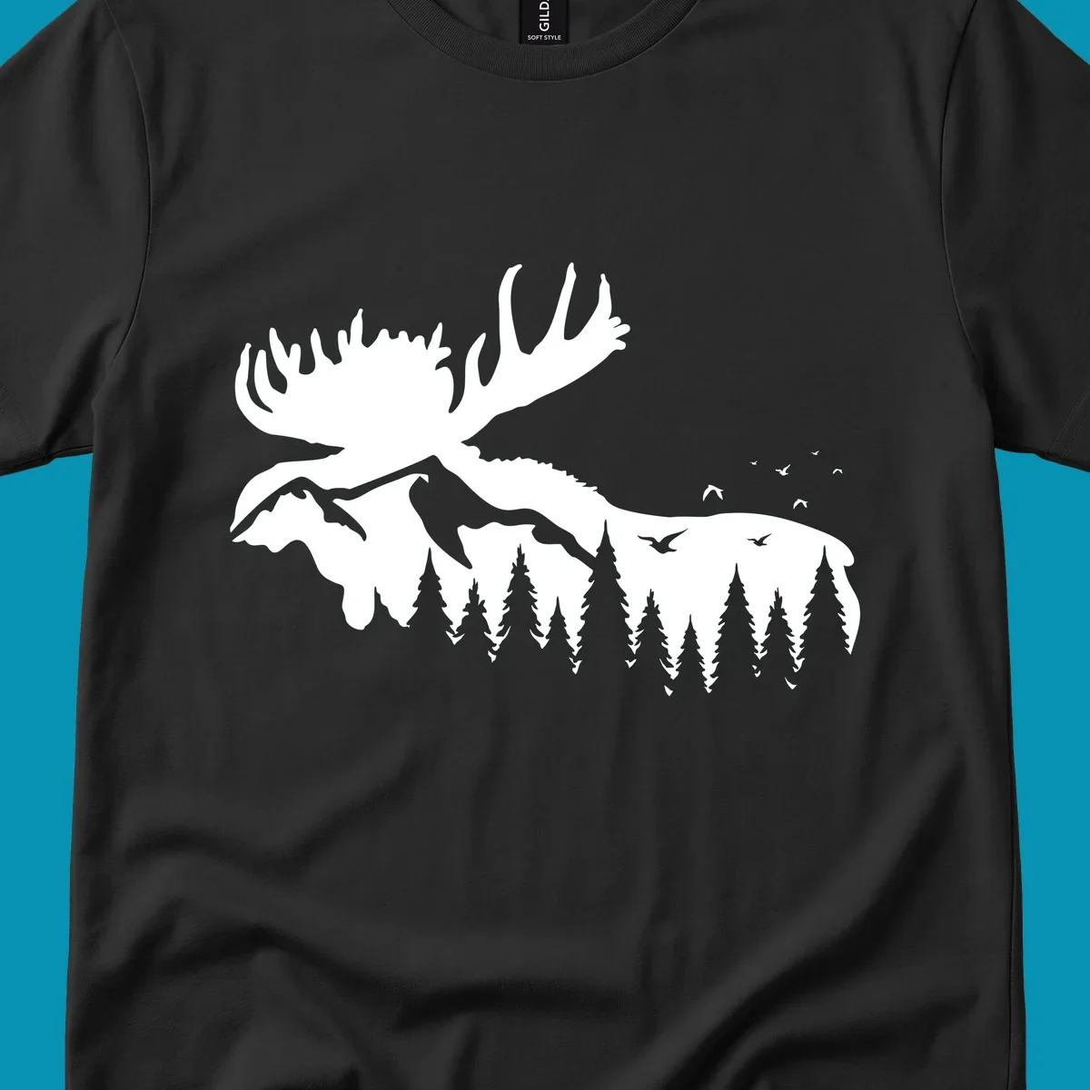 White silhouette of a moose with large antlers integrated into a forested mountain landscape with evergreen trees and flying birds against gray background.