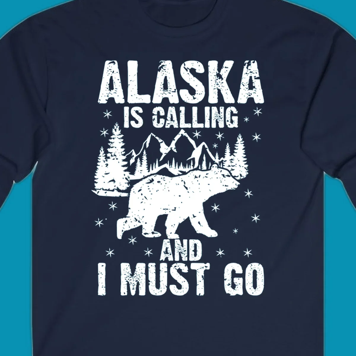 Distressed vintage design with polar bear in snowy mountains, text reads 'Alaska Is Calling And I Must Go'