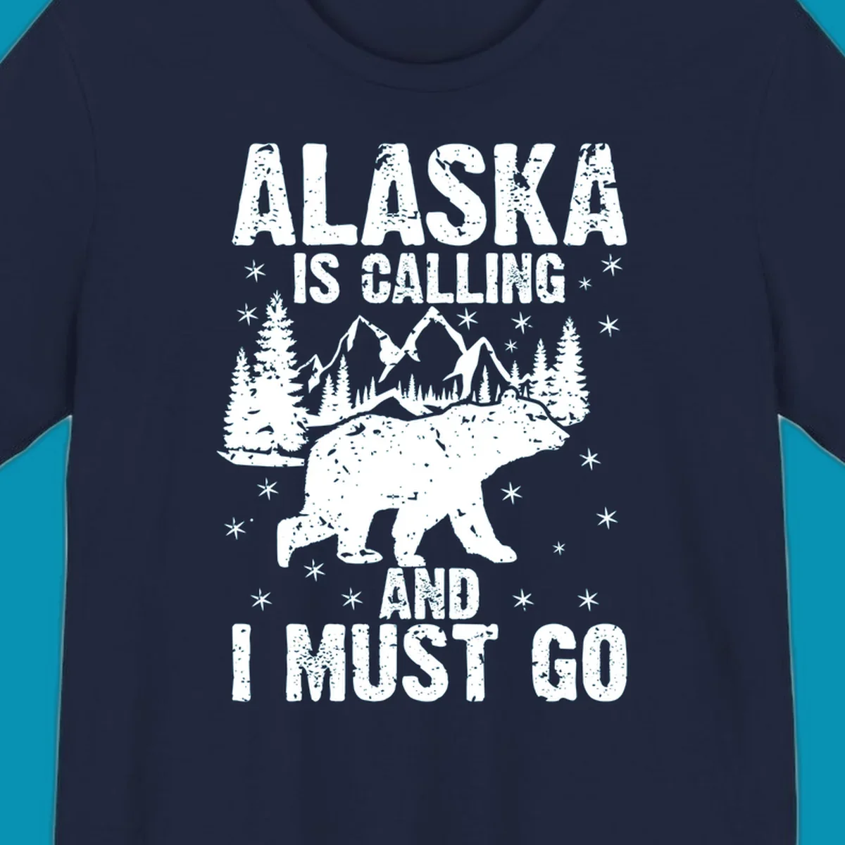 Distressed vintage design with polar bear in snowy mountains, text reads 'Alaska Is Calling And I Must Go'