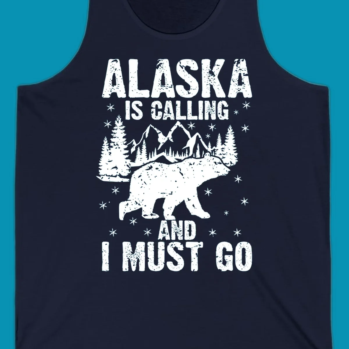 Distressed vintage design with polar bear in snowy mountains, text reads 'Alaska Is Calling And I Must Go'