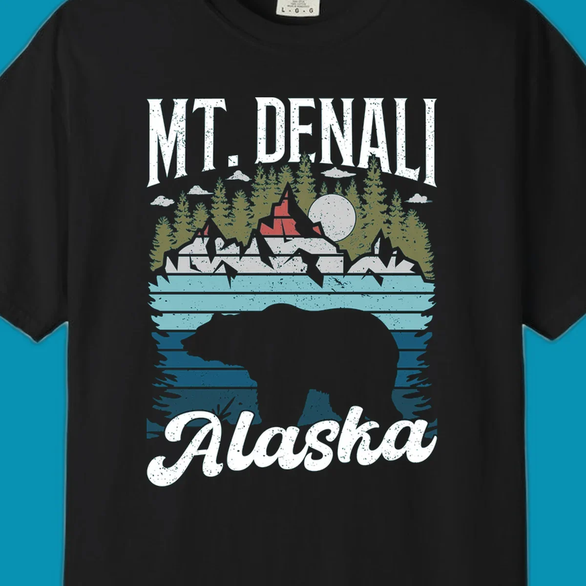 Bear cave winter wonderland illustration with bear head silhouette, snow cabin, evergreen forest, frozen lake, and moon for Alaska cruise shirt design.