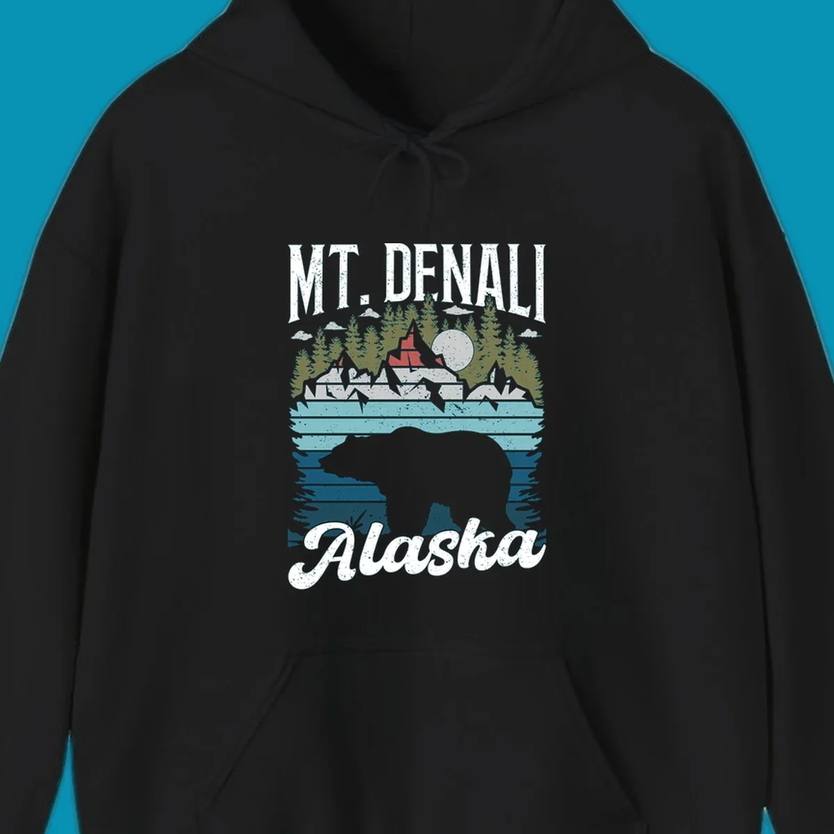 Bear cave winter wonderland illustration with bear head silhouette, snow cabin, evergreen forest, frozen lake, and moon for Alaska cruise shirt design.