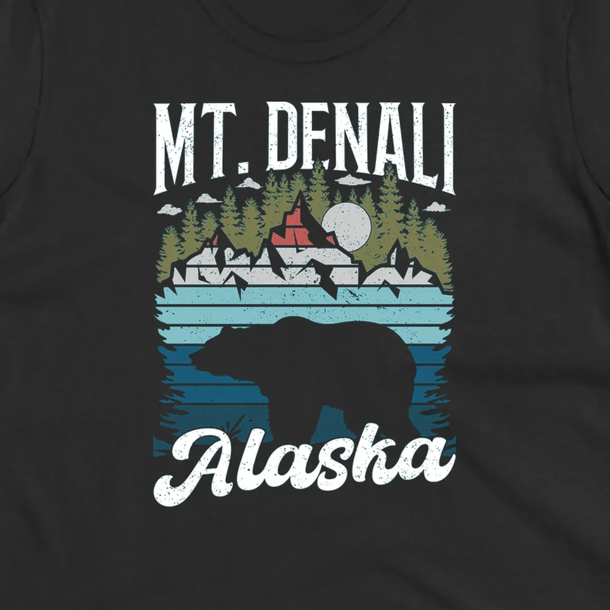 Bear cave winter wonderland illustration with bear head silhouette, snow cabin, evergreen forest, frozen lake, and moon for Alaska cruise shirt design.