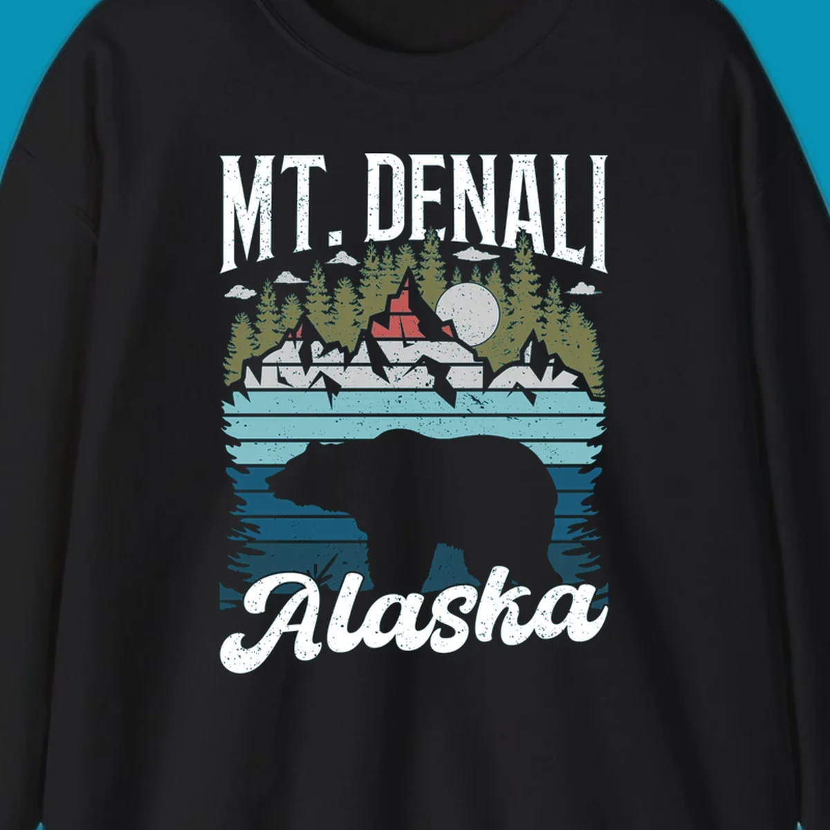 Bear cave winter wonderland illustration with bear head silhouette, snow cabin, evergreen forest, frozen lake, and moon for Alaska cruise shirt design.