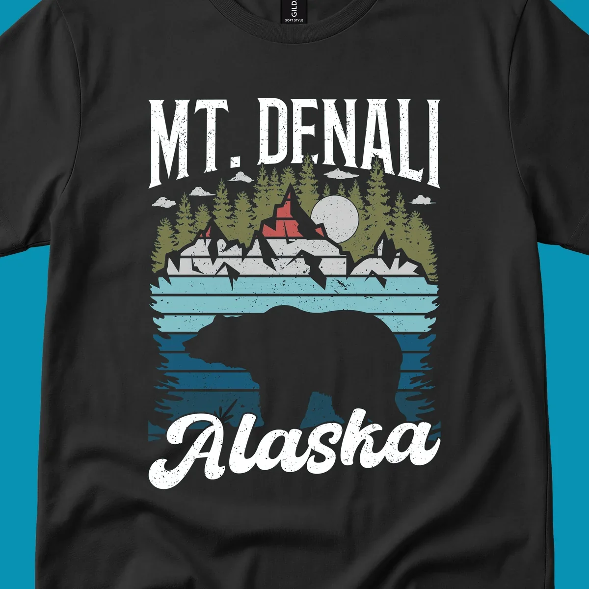 Bear cave winter wonderland illustration with bear head silhouette, snow cabin, evergreen forest, frozen lake, and moon for Alaska cruise shirt design.