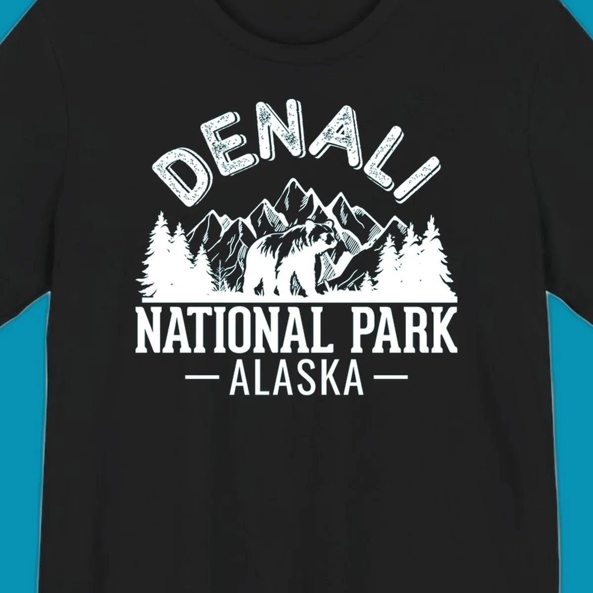 Denali National Park bear design with mountains, evergreen trees, and distressed white text on gray background