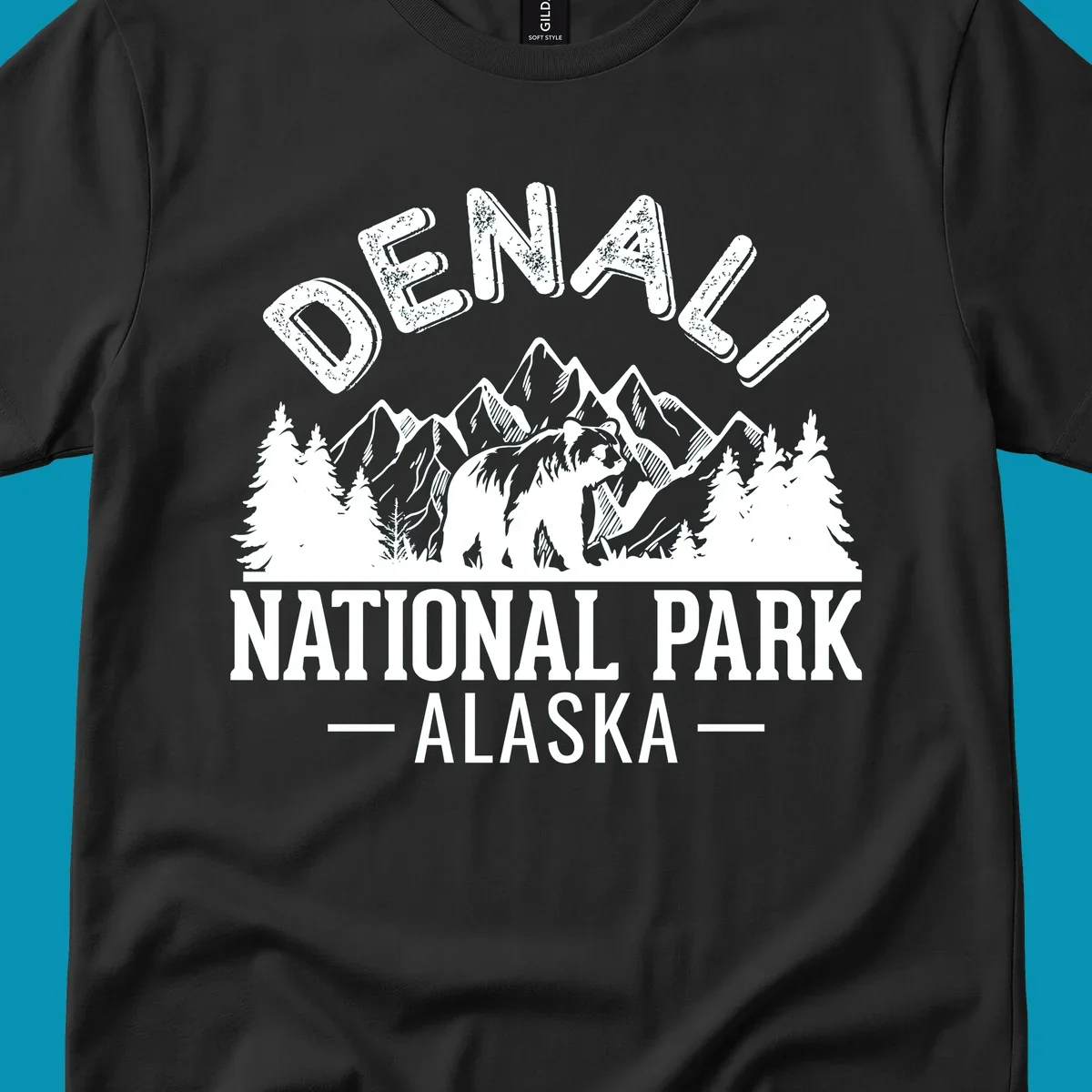Denali National Park bear design with mountains, evergreen trees, and distressed white text on gray background