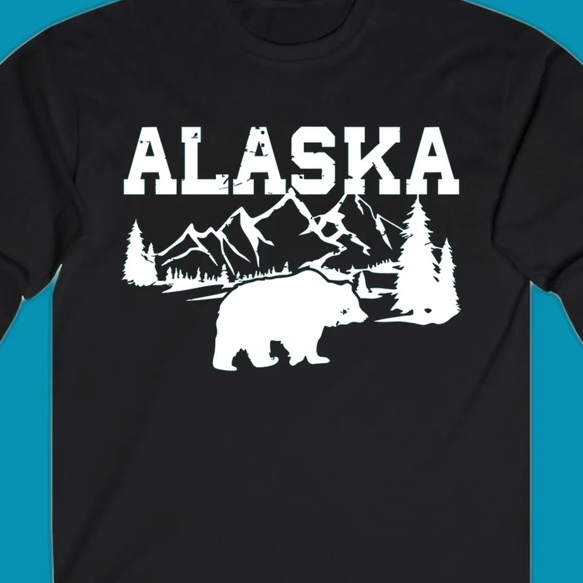 White silhouette illustration of a bear with mountains, evergreen trees, and river landscape under Alaska text on gray background