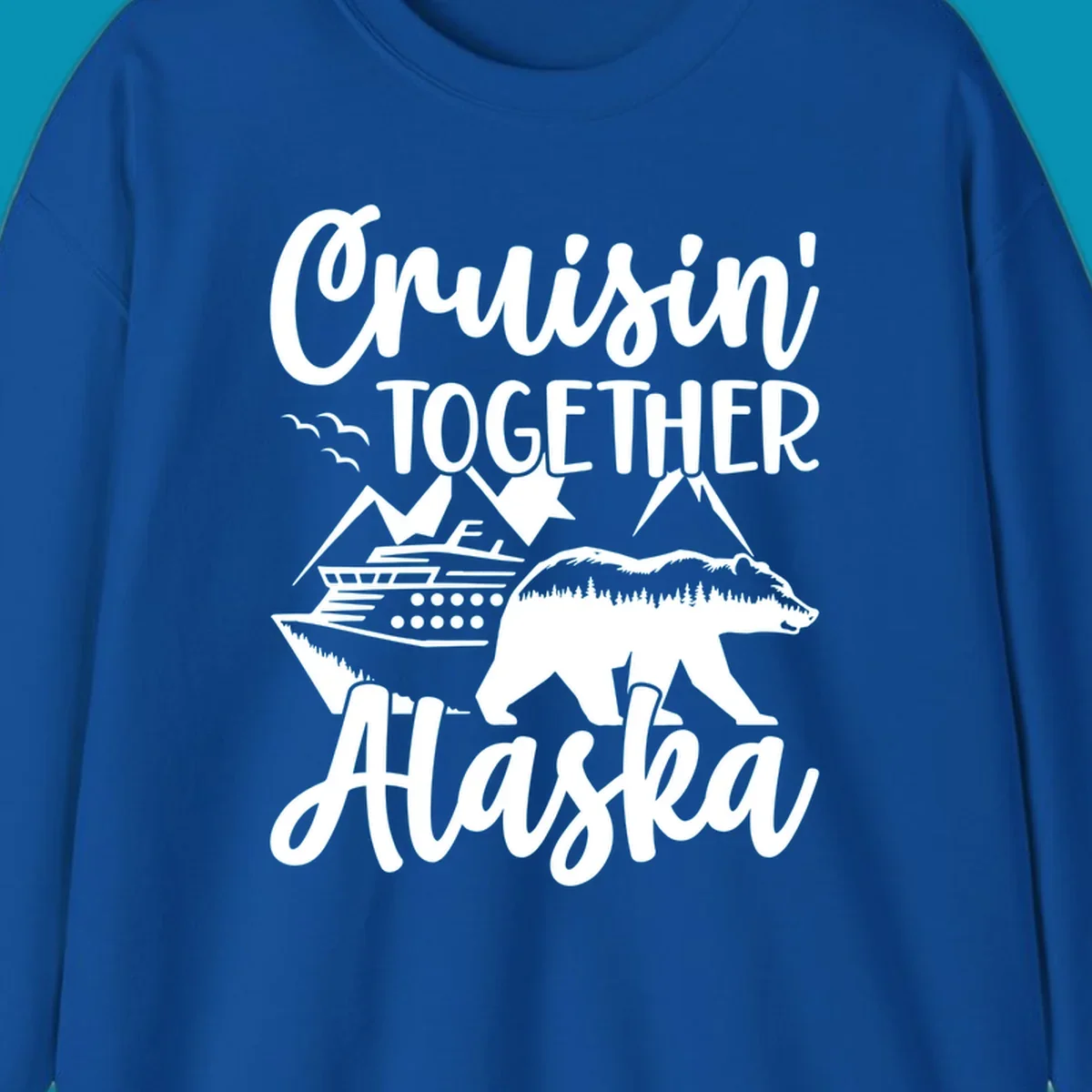 White illustration on gray background featuring 'Cruisin' Together Alaska' text with cruise ship, mountains, forest-filled bear, and pine trees