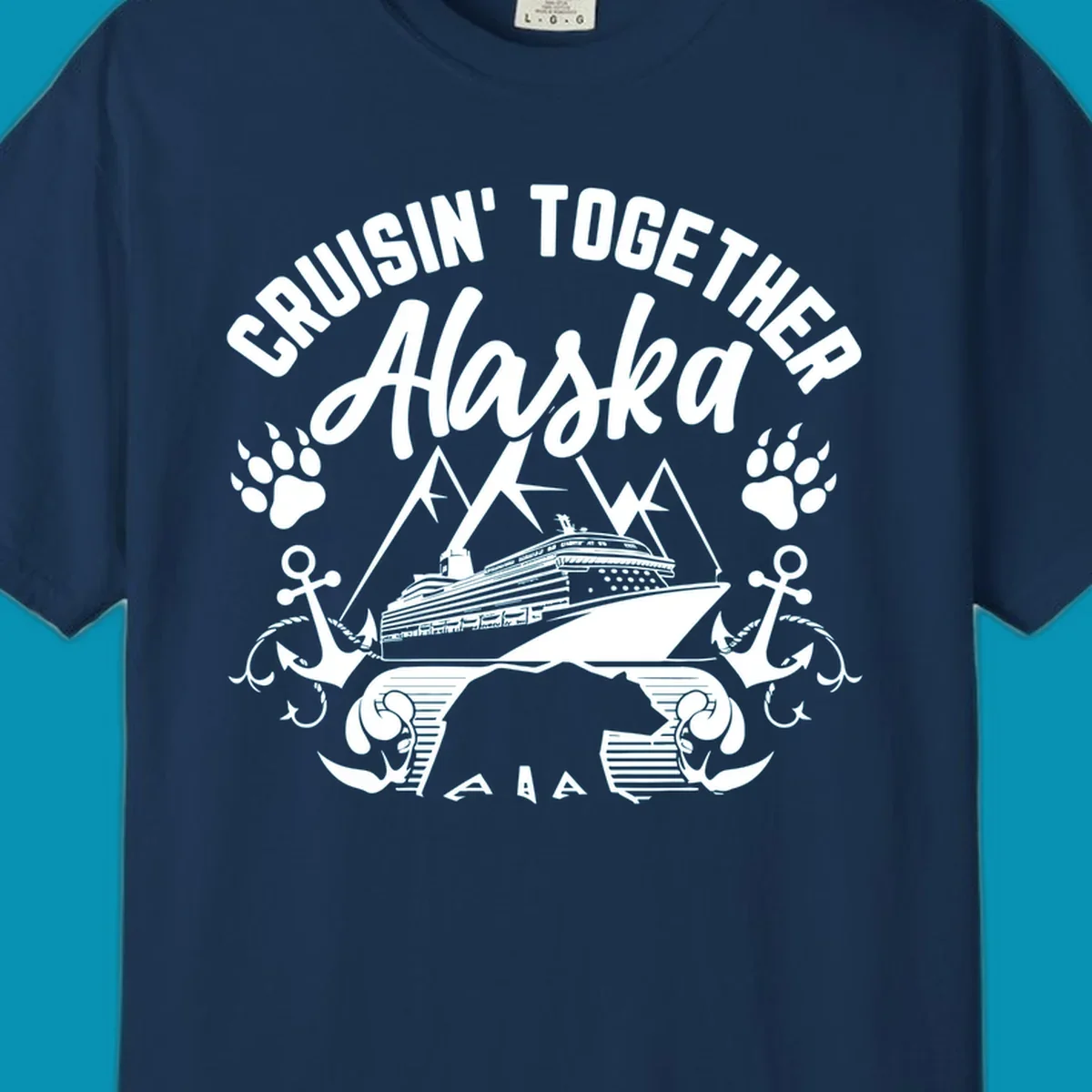 White nautical design on gray background featuring cruise ship between mountains with paw prints and anchors, text reads 'Cruisin' Together Alaska'