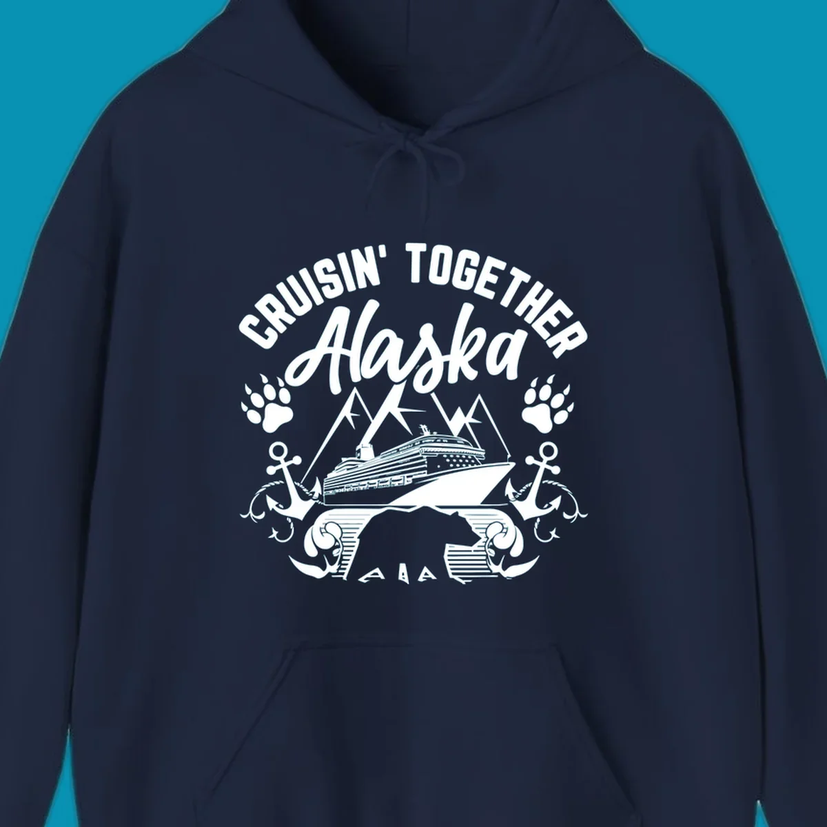 White nautical design on gray background featuring cruise ship between mountains with paw prints and anchors, text reads 'Cruisin' Together Alaska'