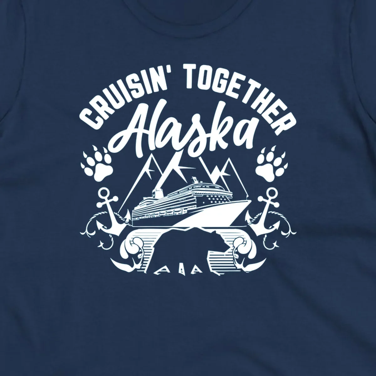 White nautical design on gray background featuring cruise ship between mountains with paw prints and anchors, text reads 'Cruisin' Together Alaska'