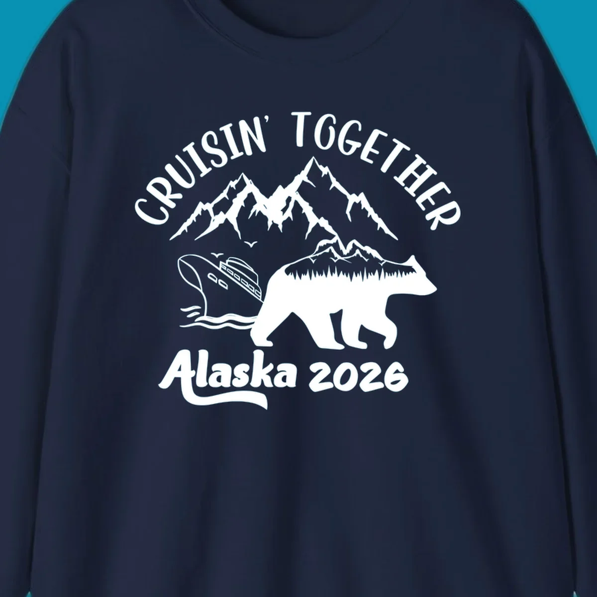 Cruisin Together Alaska 2026 design: bear silhouette filled with mountains and forest, surrounded by peaks, canoe, and water waves with text