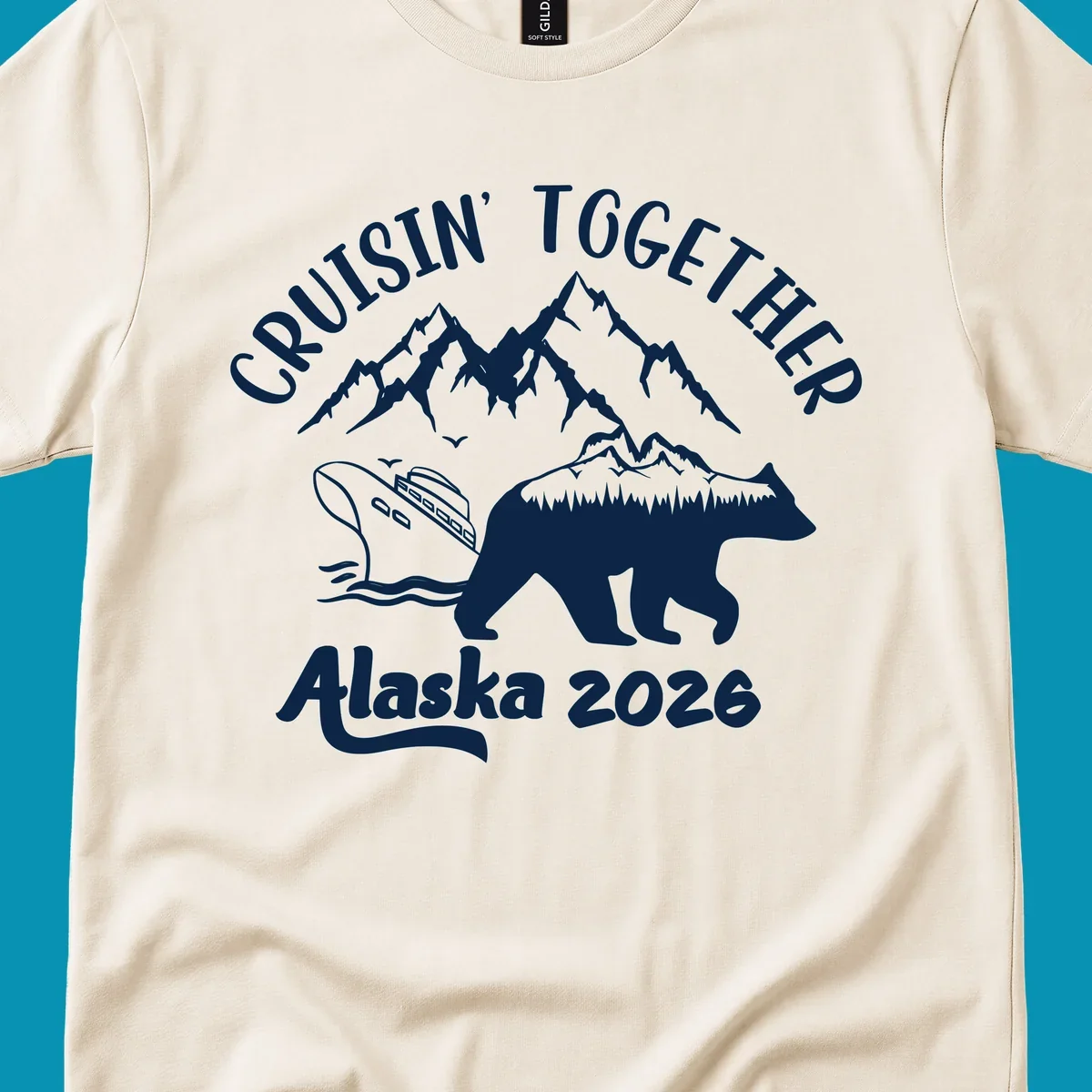 Cruisin Together Alaska 2026 design: bear silhouette filled with mountains and forest, surrounded by peaks, canoe, and water waves with text