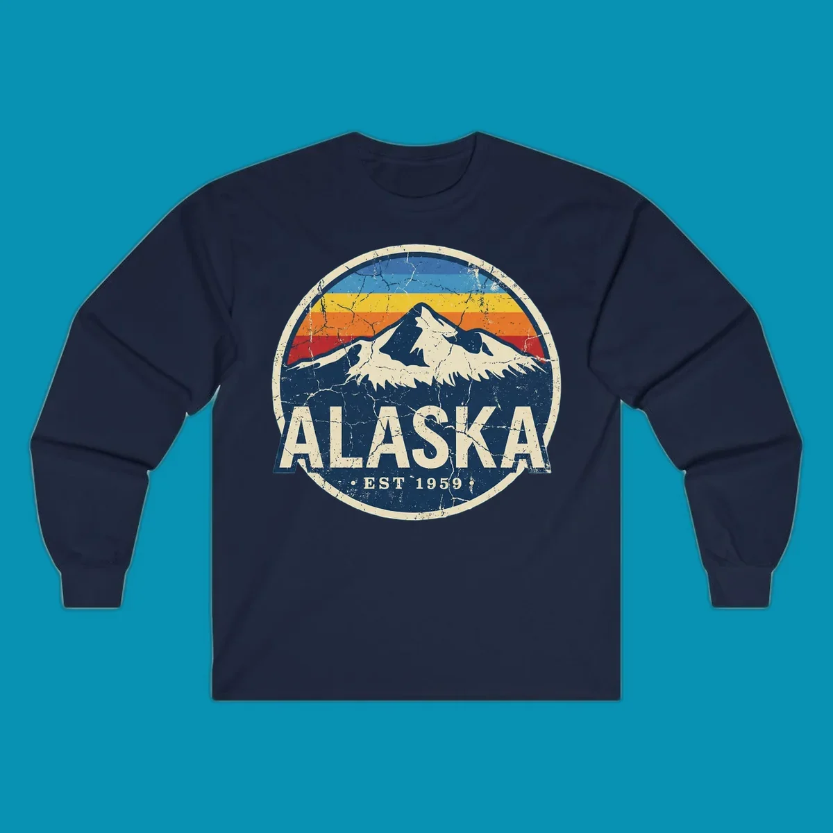 Vintage circular badge with snow-capped Alaska mountain, retro rainbow stripes, and distressed cream border featuring 'ALASKA EST 1959' text