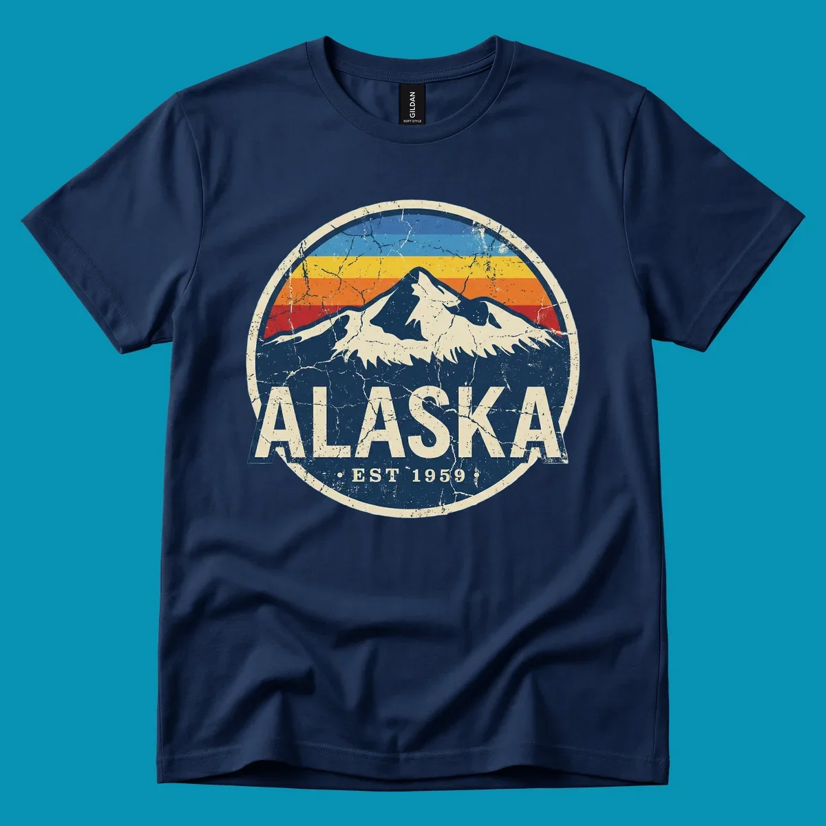 Vintage circular badge with snow-capped Alaska mountain, retro rainbow stripes, and distressed cream border featuring 'ALASKA EST 1959' text
