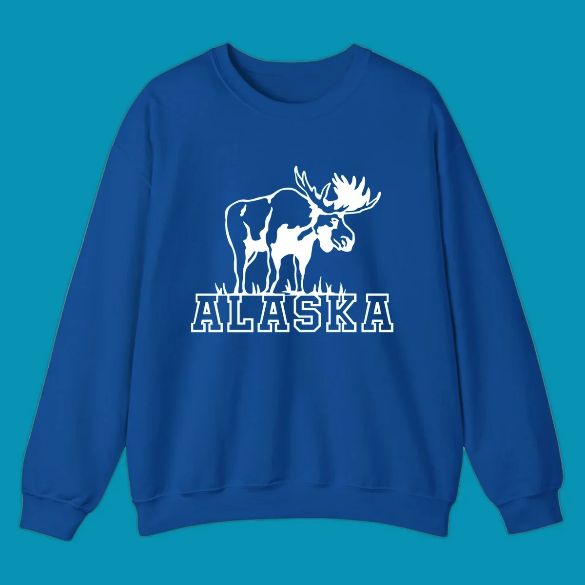White silhouette of a majestic moose with large antlers standing with grass below and ALASKA text, moose-alaska-silhouette design