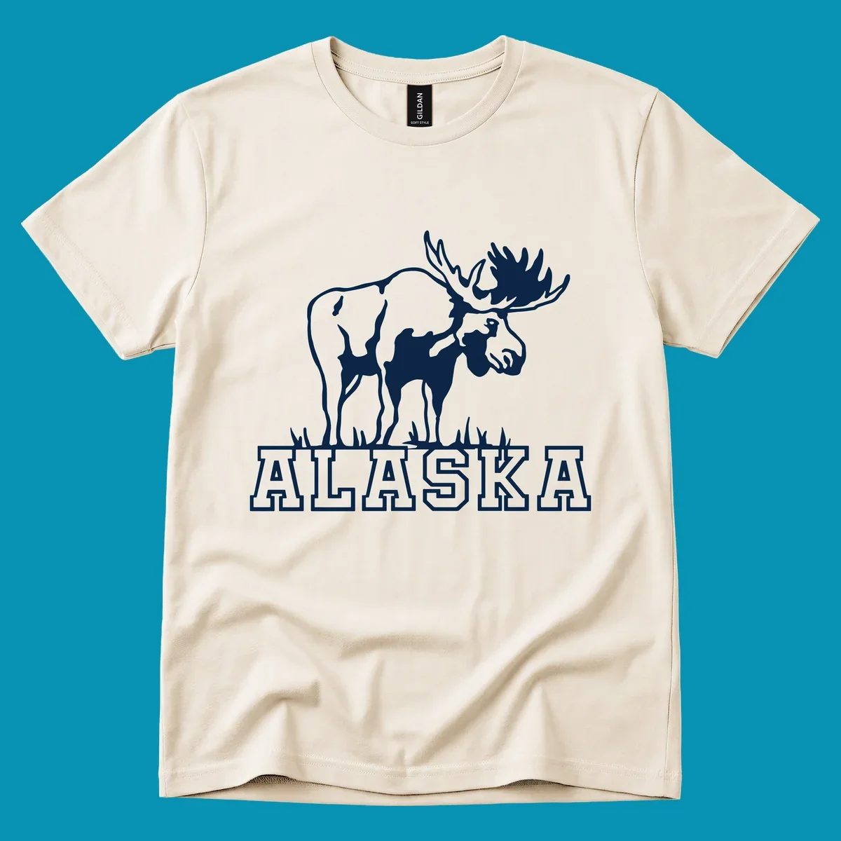 White silhouette of a majestic moose with large antlers standing with grass below and ALASKA text, moose-alaska-silhouette design