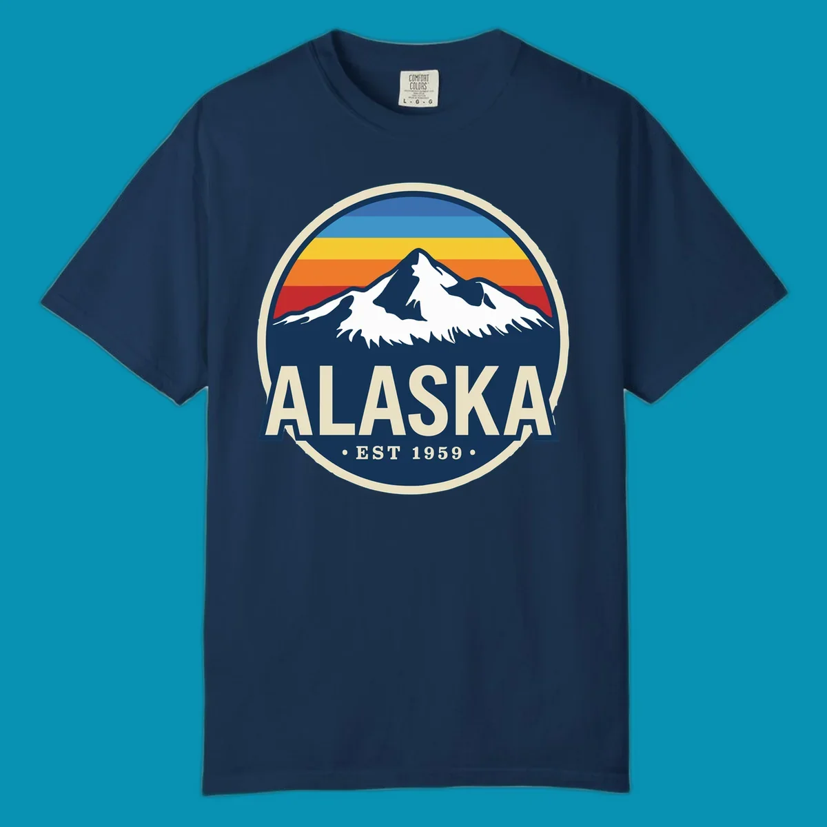 A circular alaska-mountain-range-sunset-badge design with retro stripes and white peaks above bold Alaska text.