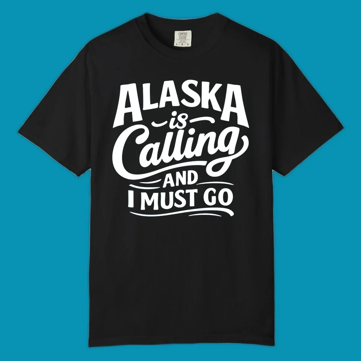 A white typography design on a black background reading Alaska is Calling and I Must Go in mixed fonts.