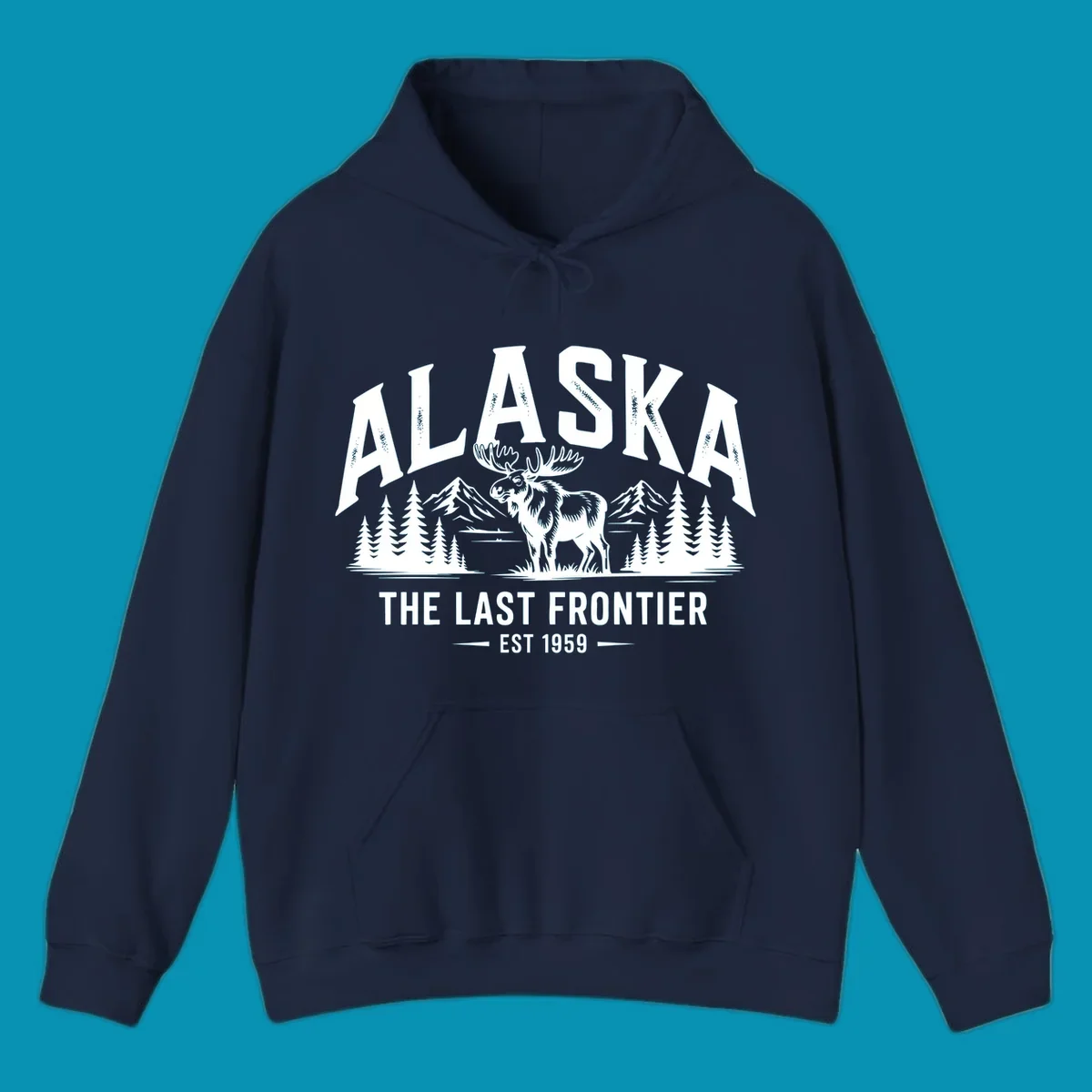 A white alaska-moose-frontier-scenic graphic showing a moose standing in front of mountains and pine trees.