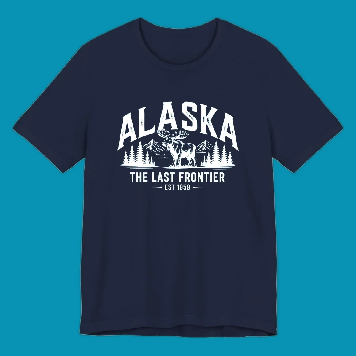 A white alaska-moose-frontier-scenic graphic showing a moose standing in front of mountains and pine trees.