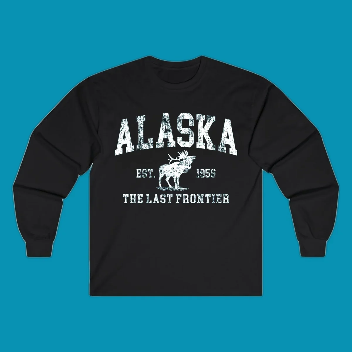 Distressed white design featuring a moose and the text ALASKA THE LAST FRONTIER.