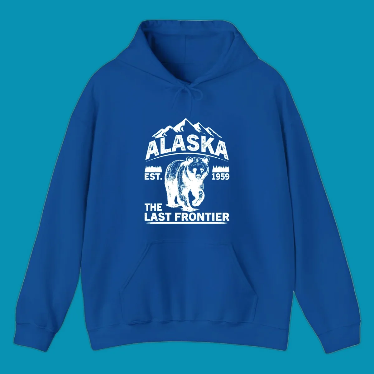 White graphic of a walking grizzly bear under mountain peaks with alaska-grizzly-frontier-mountains text.