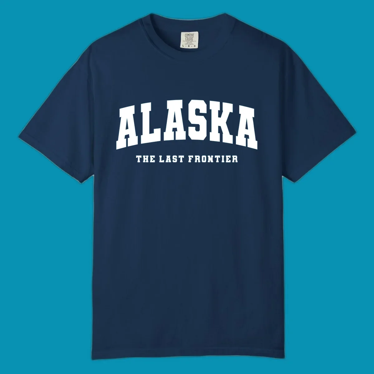 White block lettering on a black background reads 'ALASKA THE LAST FRONTIER', with 'ALASKA' larger. Design concept: alaska-last-frontier-typography.