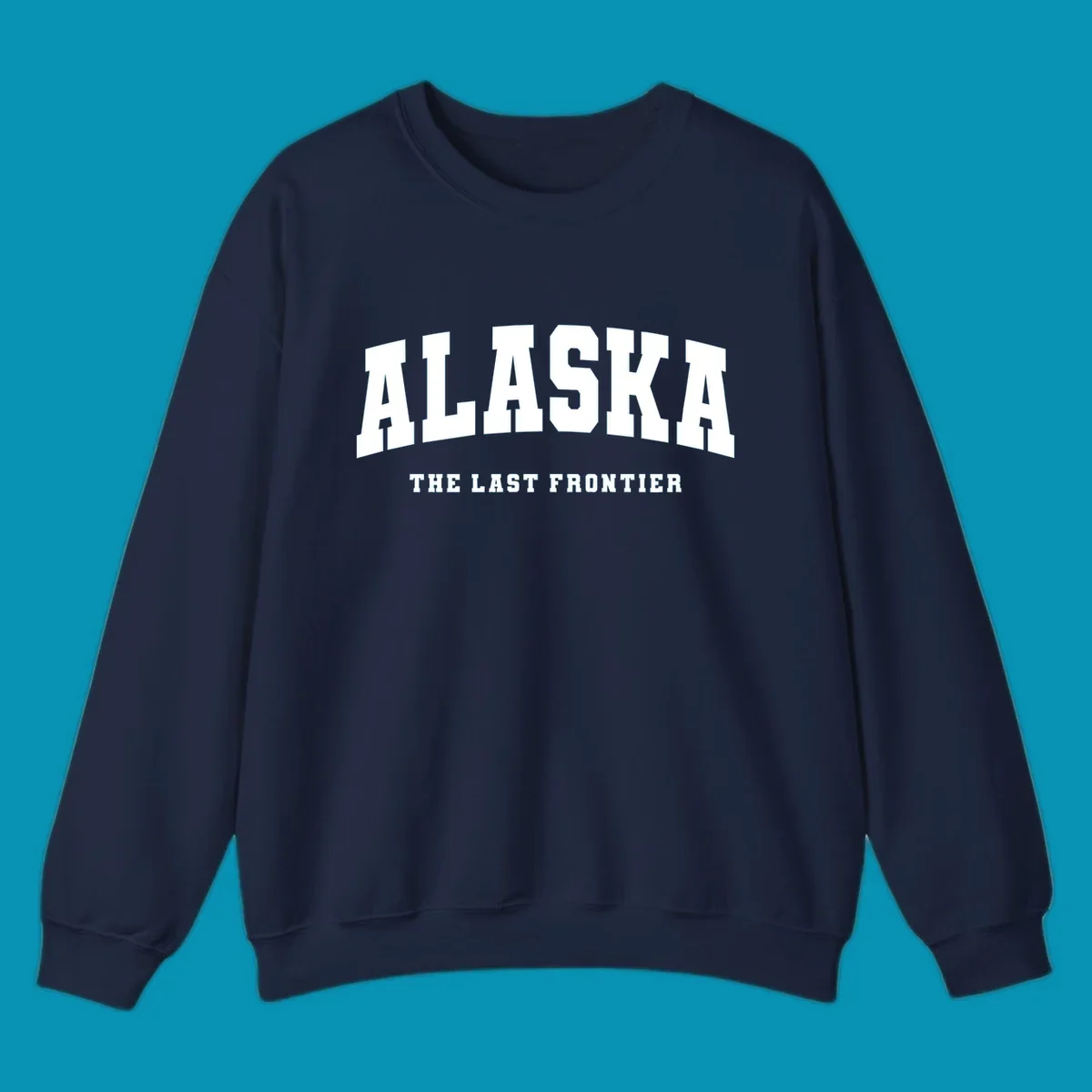 White block lettering on a black background reads 'ALASKA THE LAST FRONTIER', with 'ALASKA' larger. Design concept: alaska-last-frontier-typography.