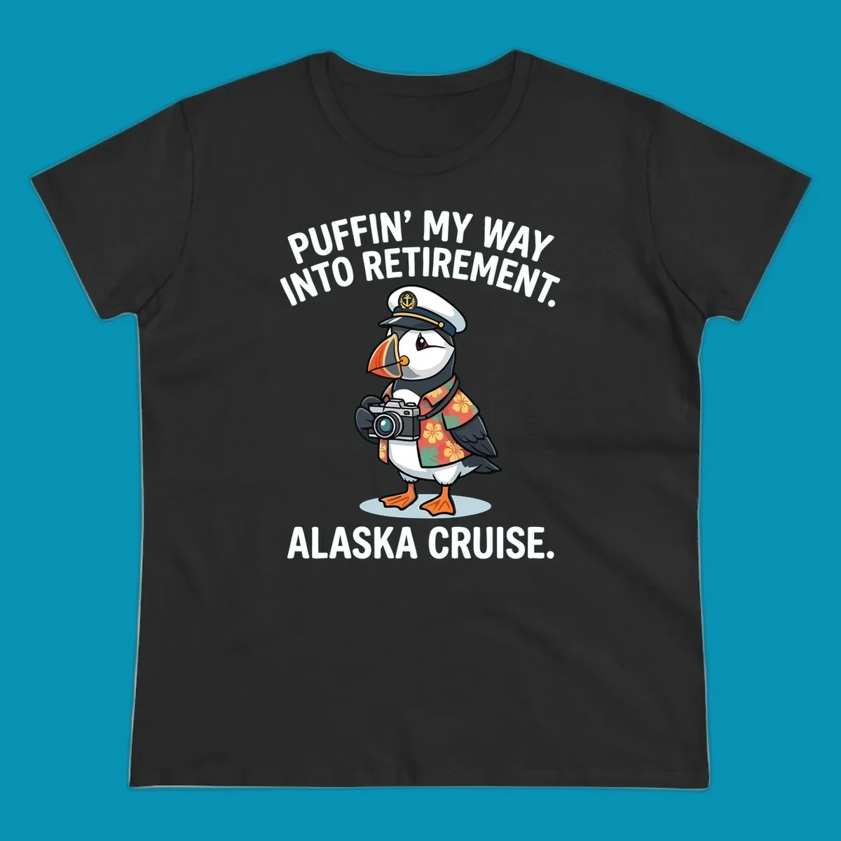 A cartoon puffin wearing a captain's hat and Hawaiian shirt holds a camera, with text 'PUFFIN' INTO MY RETIREMENT. ALASKA CRUISE.' for a puffin-into-retirement-cruise.