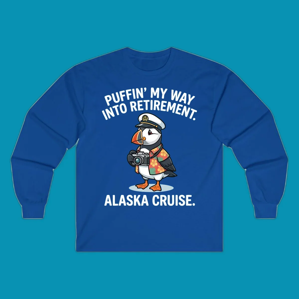 A cartoon puffin wearing a captain's hat and Hawaiian shirt holds a camera, with text 'PUFFIN' INTO MY RETIREMENT. ALASKA CRUISE.' for a puffin-into-retirement-cruise.