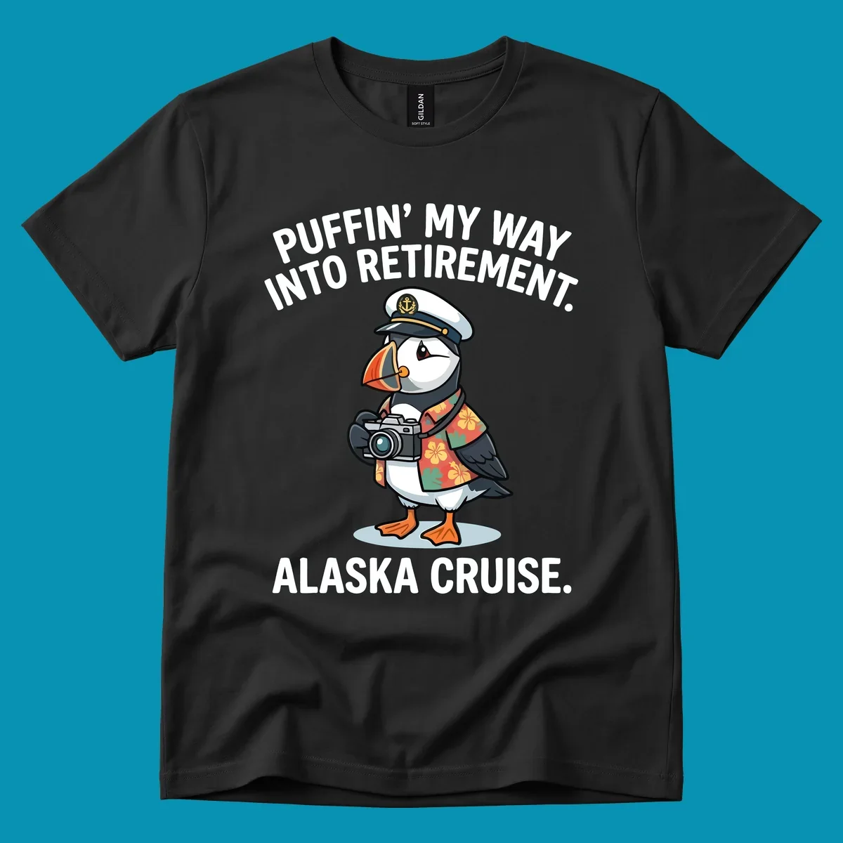 A cartoon puffin wearing a captain's hat and Hawaiian shirt holds a camera, with text 'PUFFIN' INTO MY RETIREMENT. ALASKA CRUISE.' for a puffin-into-retirement-cruise.