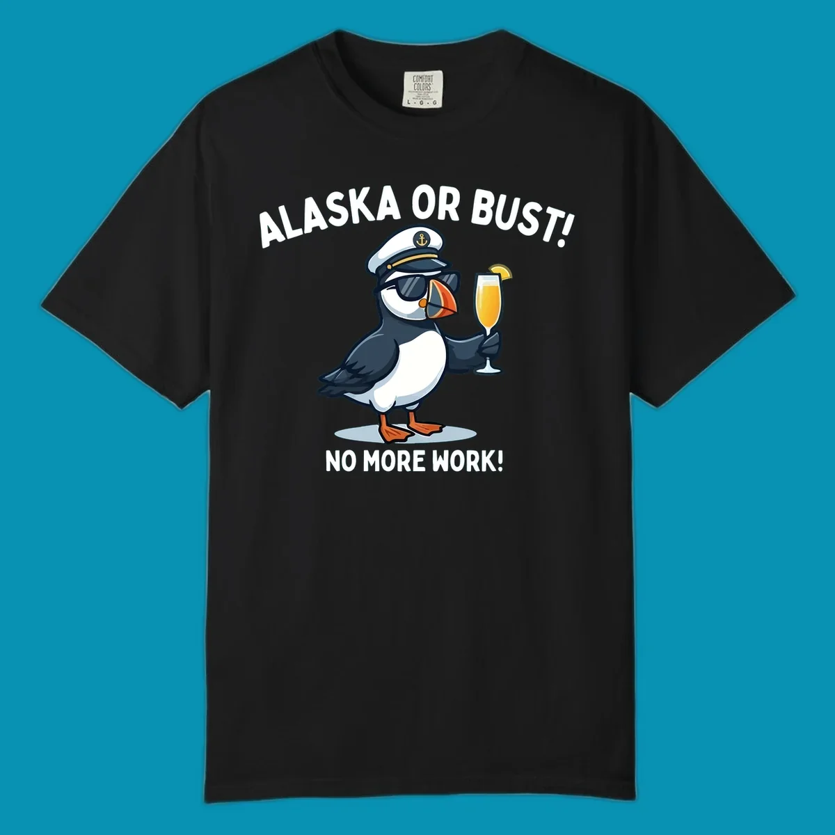 An illustrated puffin captain in sunglasses and a hat holds a cocktail with a lemon slice, with 'ALASKA OR BUST!' and 'NO MORE WORK!' text, representing the alaska-or-bust-captain-puffin concept.