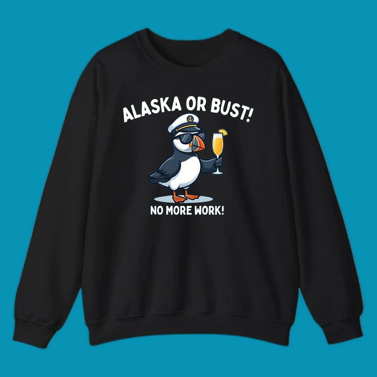 An illustrated puffin captain in sunglasses and a hat holds a cocktail with a lemon slice, with 'ALASKA OR BUST!' and 'NO MORE WORK!' text, representing the alaska-or-bust-captain-puffin concept.
