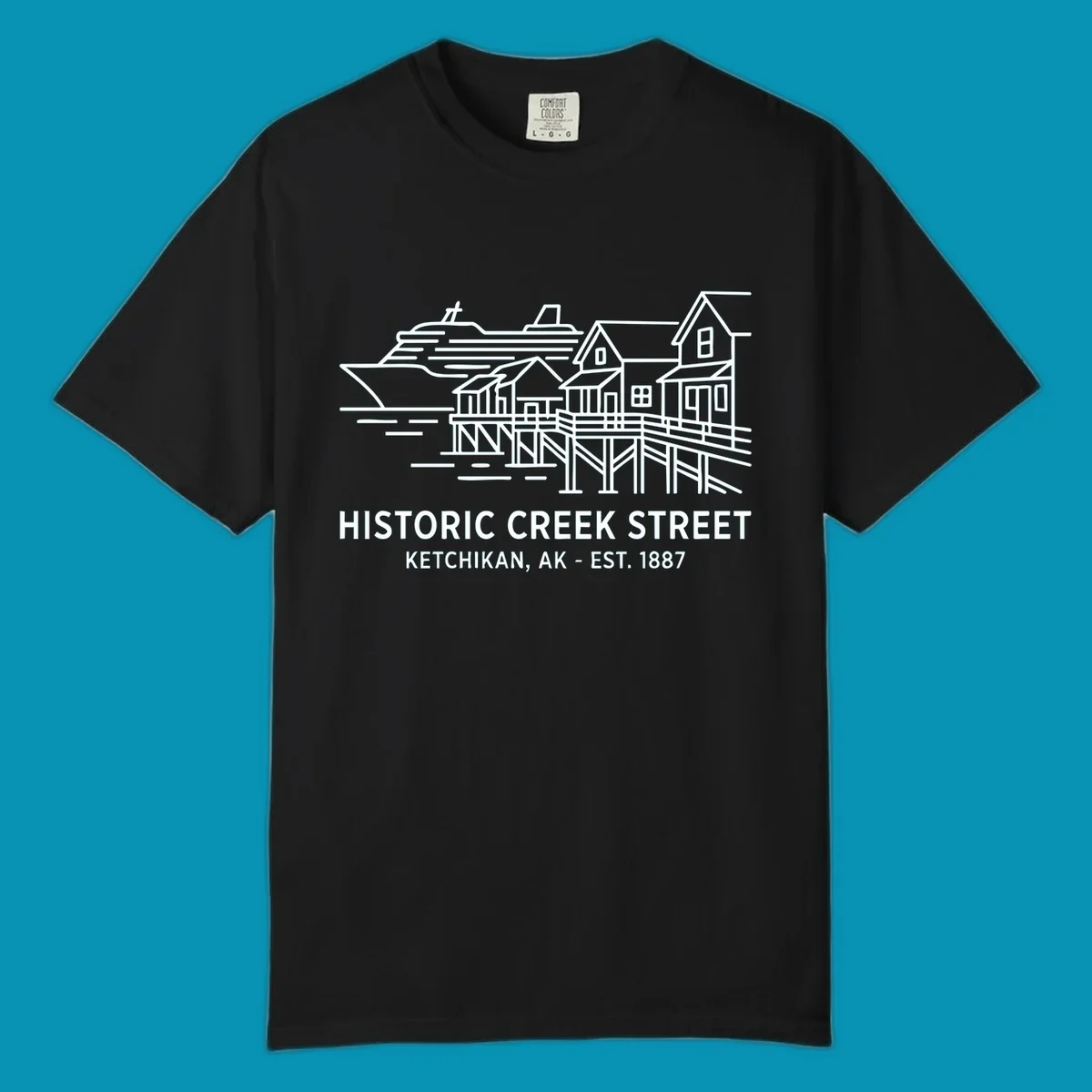 White line art illustration of Historic Creek Street in Ketchikan, Alaska, with a cruise ship, waterfront buildings, and text.