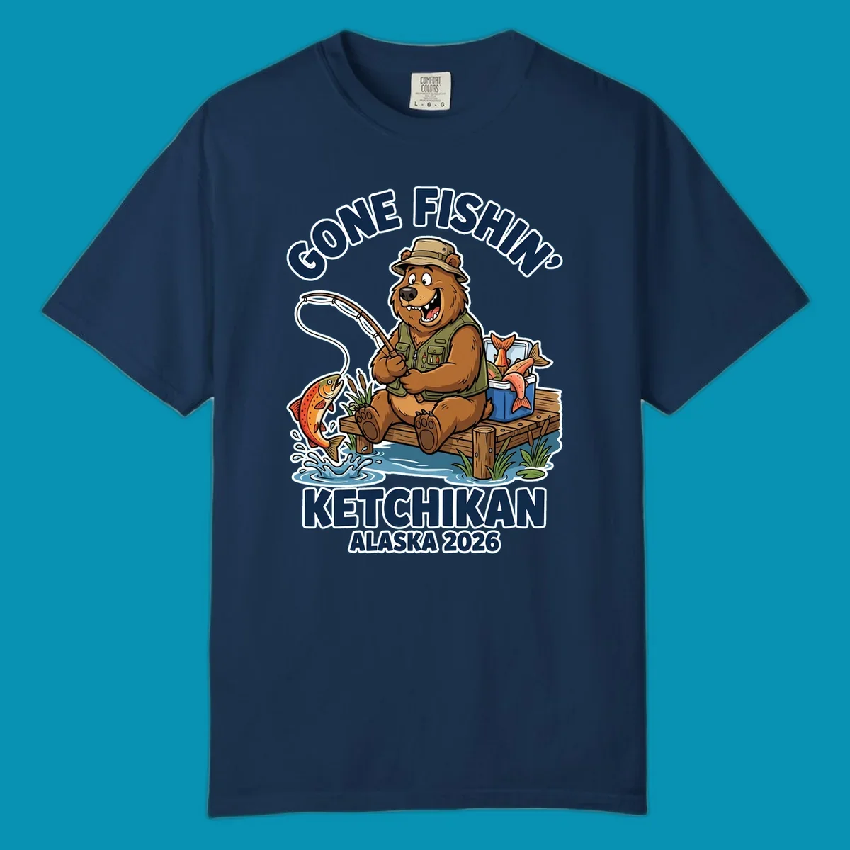 Cartoon bear in hat and vest fishing from a dock, with a fish on the line and cooler. Text: 'GONE FISHIN' KETCHIKAN ALASKA 2026'. Ideal for a gone-fishin-ketchikan-bear themed Alaska cruise.