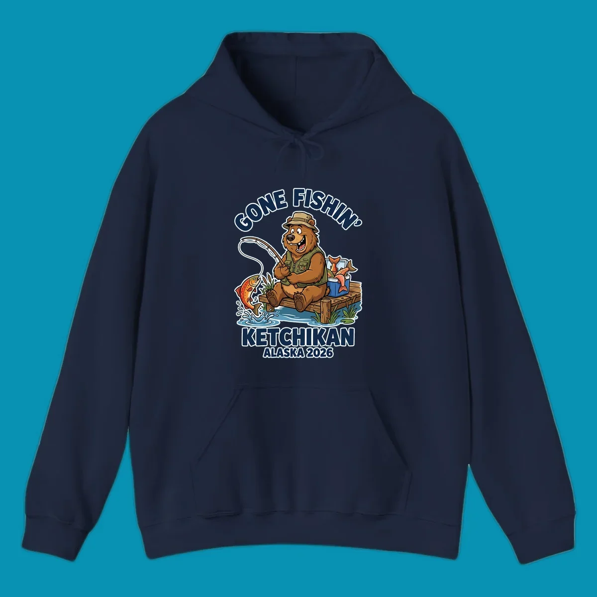 Cartoon bear in hat and vest fishing from a dock, with a fish on the line and cooler. Text: 'GONE FISHIN' KETCHIKAN ALASKA 2026'. Ideal for a gone-fishin-ketchikan-bear themed Alaska cruise.